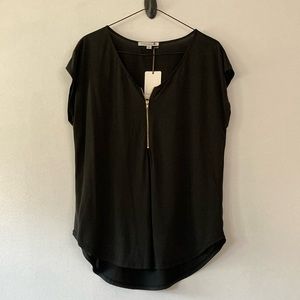 Black top with gold zipper detail